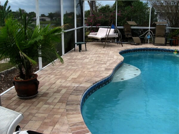 photo of tile stone installation around outdoor pool deck